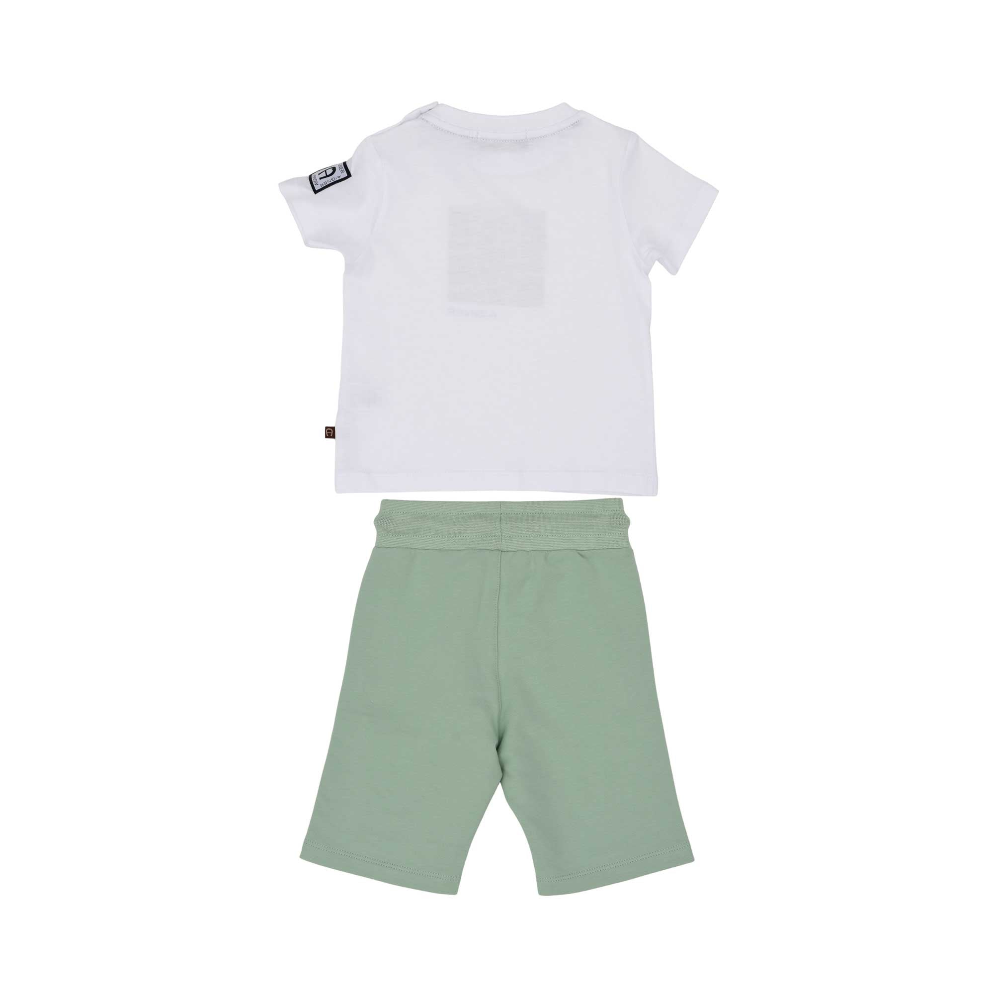 The reverse side of the white and forest green Aigner Kids set. Shows the plain white back of the T-shirt and the back of the green shorts, which feature two functional patch pockets and an elasticated waistband.