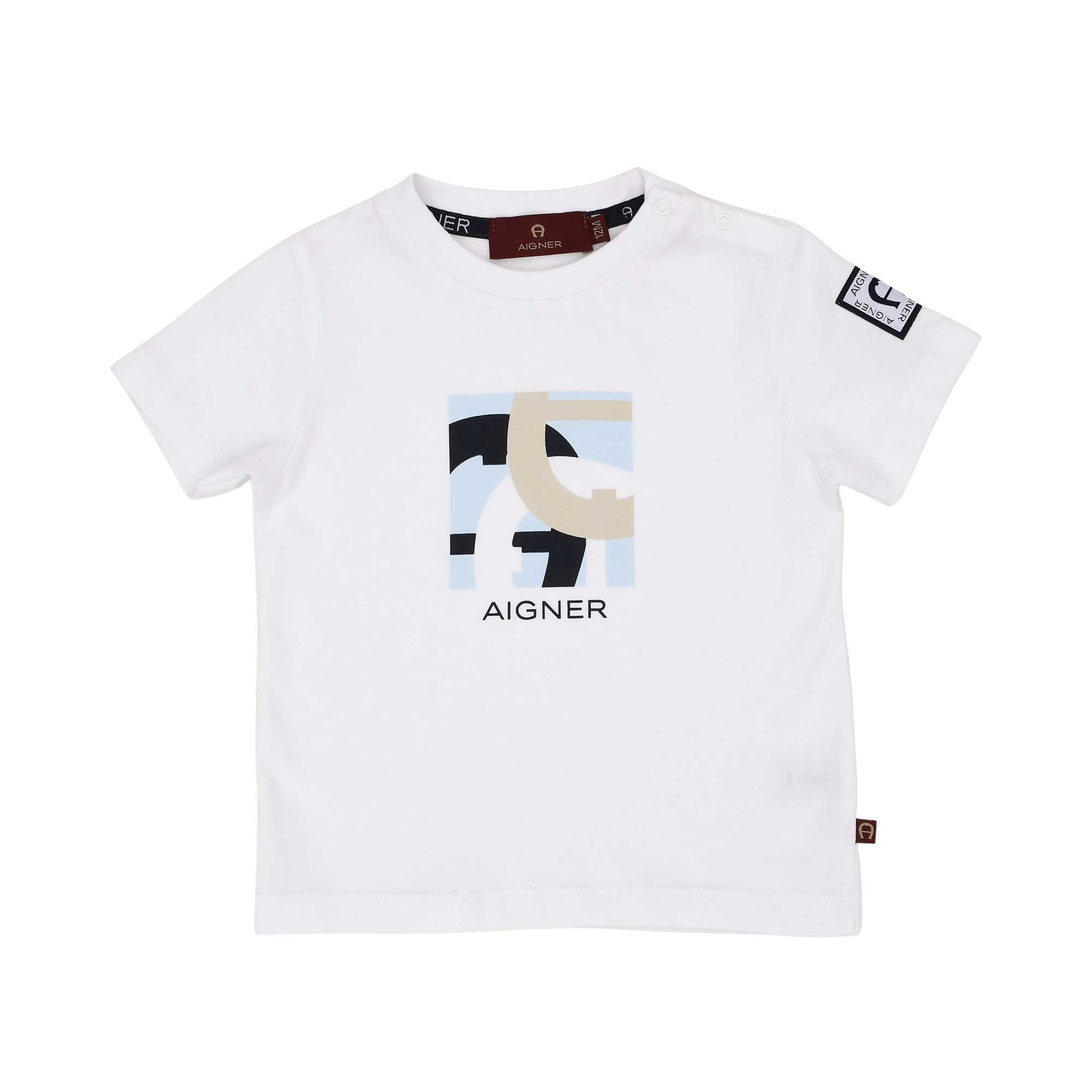 Front view of a white  and beige Aigner Kids baby T-shirt featuring a sage green and blue abstract horseshoe logo graphic on the chest and popper buttons on the shoulder.