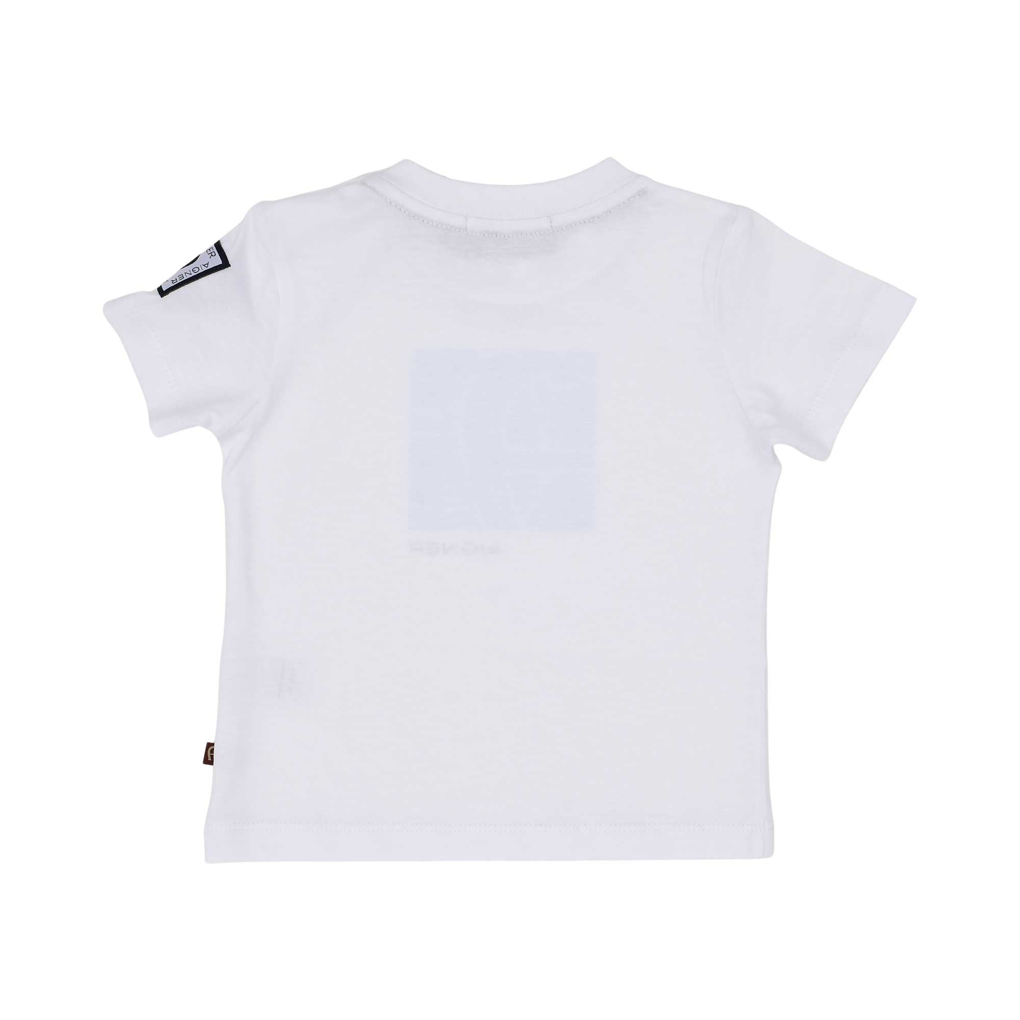 The reverse side of a plain white Aigner Kids baby t-shirt showing the clean stitching at the neckline and hem, with the logo tape visible on the sleeve edge.