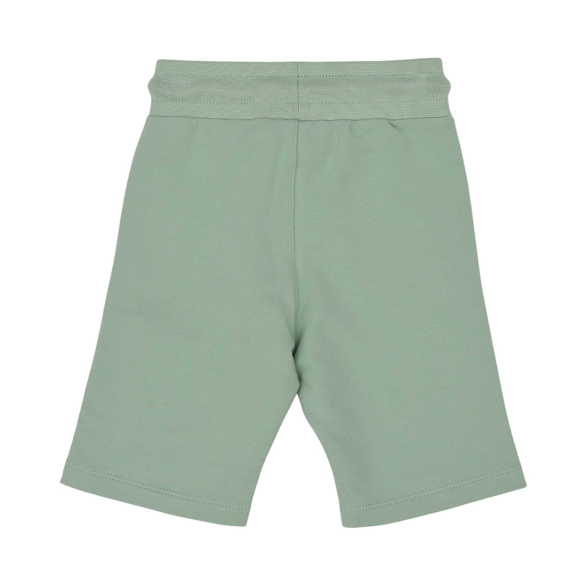 Back view of the forest green baby shorts. It shows the texture of the cotton fabric, the dark green and white braided drawstring, and the signature Aigner horseshoe logo patch in white and green.