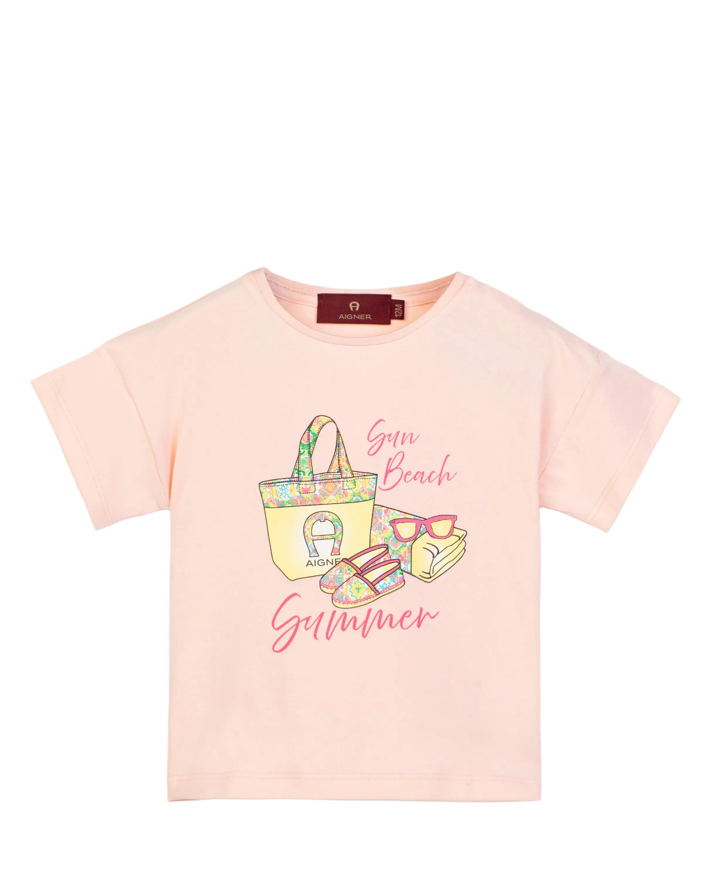 Front view of an Aigner Kids girls short-sleeved T-shirt in pastel pink, featuring a "Sun Beach Summer" graphic print with a tote bag and sunglasses.