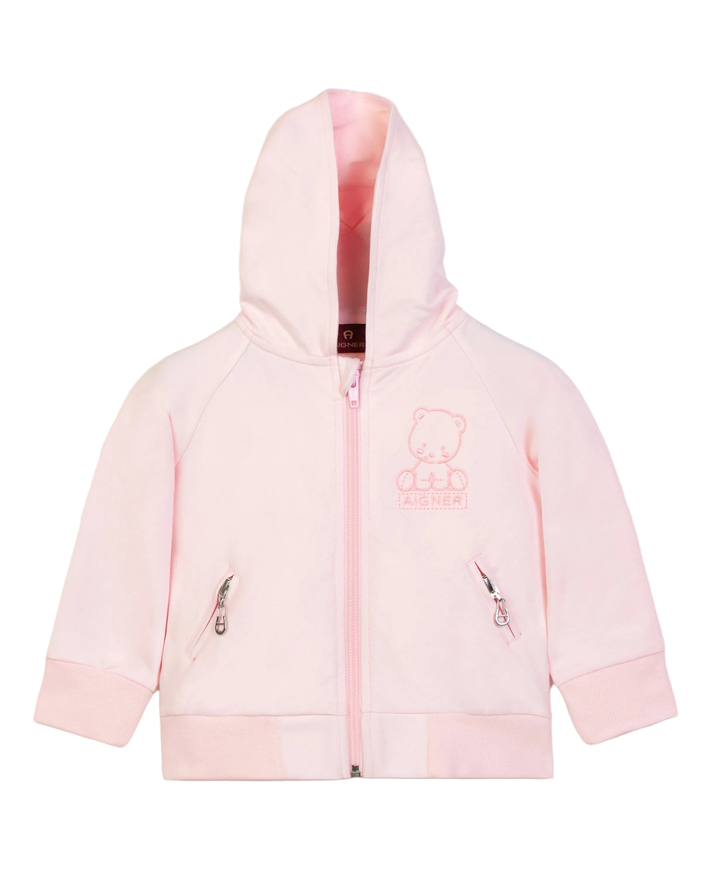 Front view close-up shot of the Aigner Kids pale pink baby zip-up hoodie, highlighting the cozy fabric hood, zip hardware, side pockets, and the finely stitched tonal teddy bear brand motif.