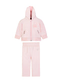 Full studio layout shot of the two-piece Aigner Kids baby girls pale pink tracksuit set, displaying the zip-up hoodie with its embroidered teddy bear chest graphic aligned above the matching pull-on joggers