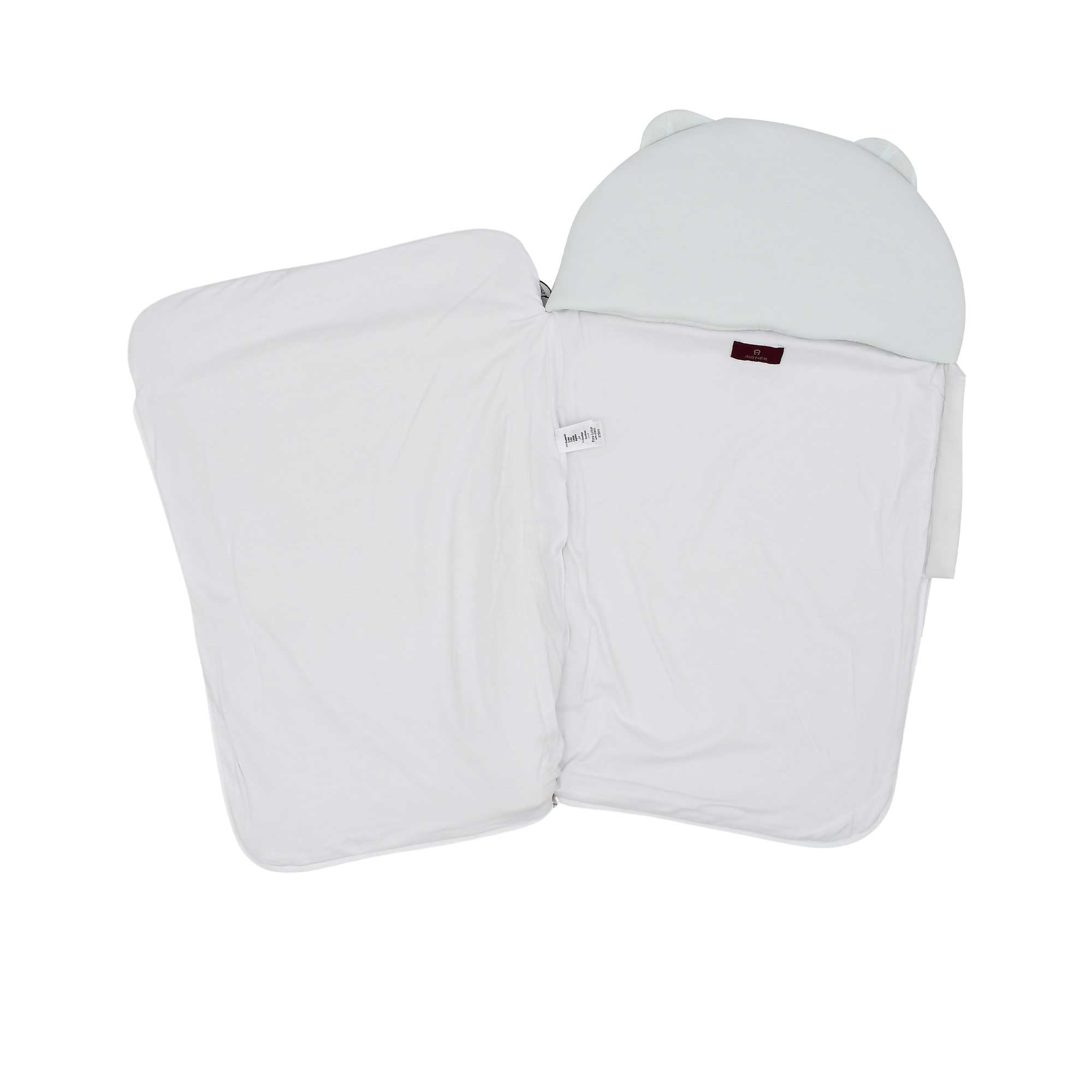 The Aigner Kids baby nest unzipped and open, showing the clean white interior lining and internal branding label.