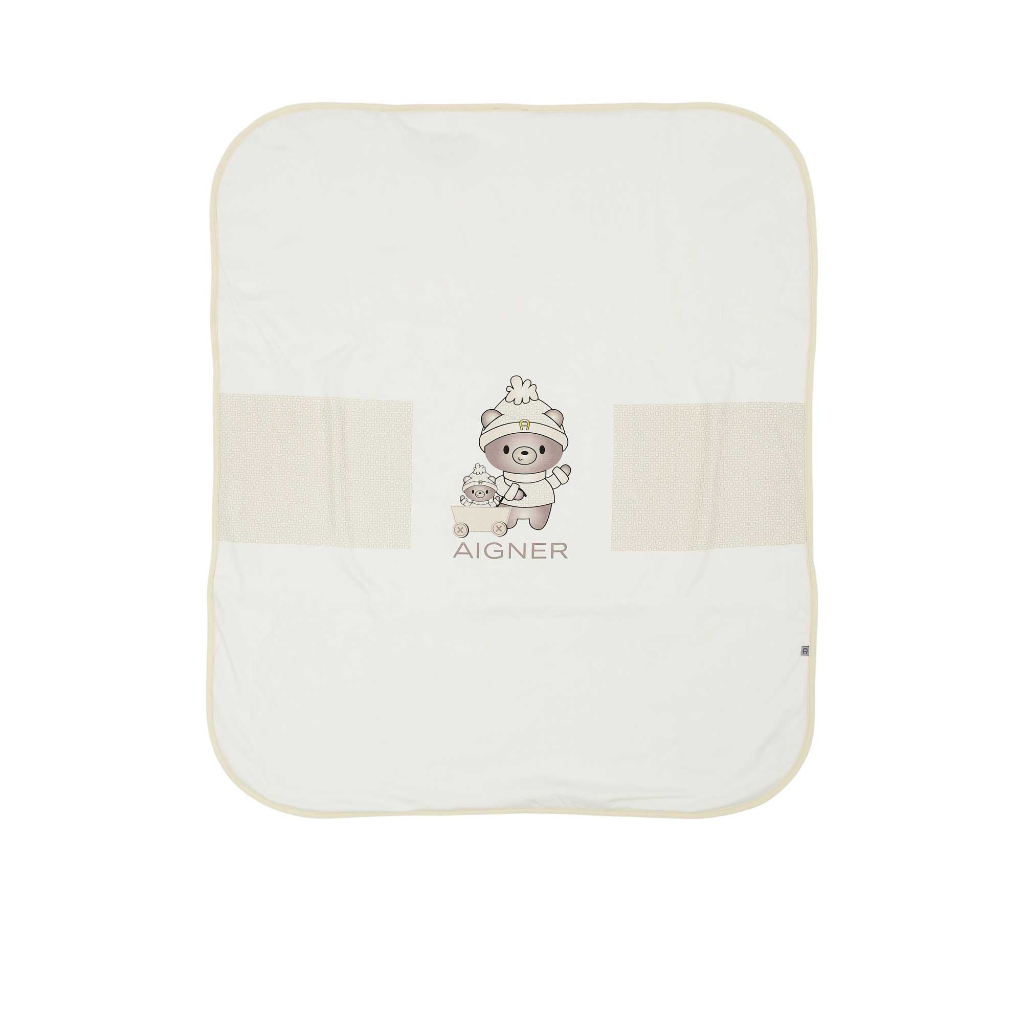 Aigner Kids cream baby blanket folded at the corner to show the soft double-layer fabric and manufacturer's care tag.