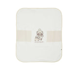 Aigner Kids cream baby blanket folded at the corner to show the soft double-layer fabric and manufacturer's care tag.