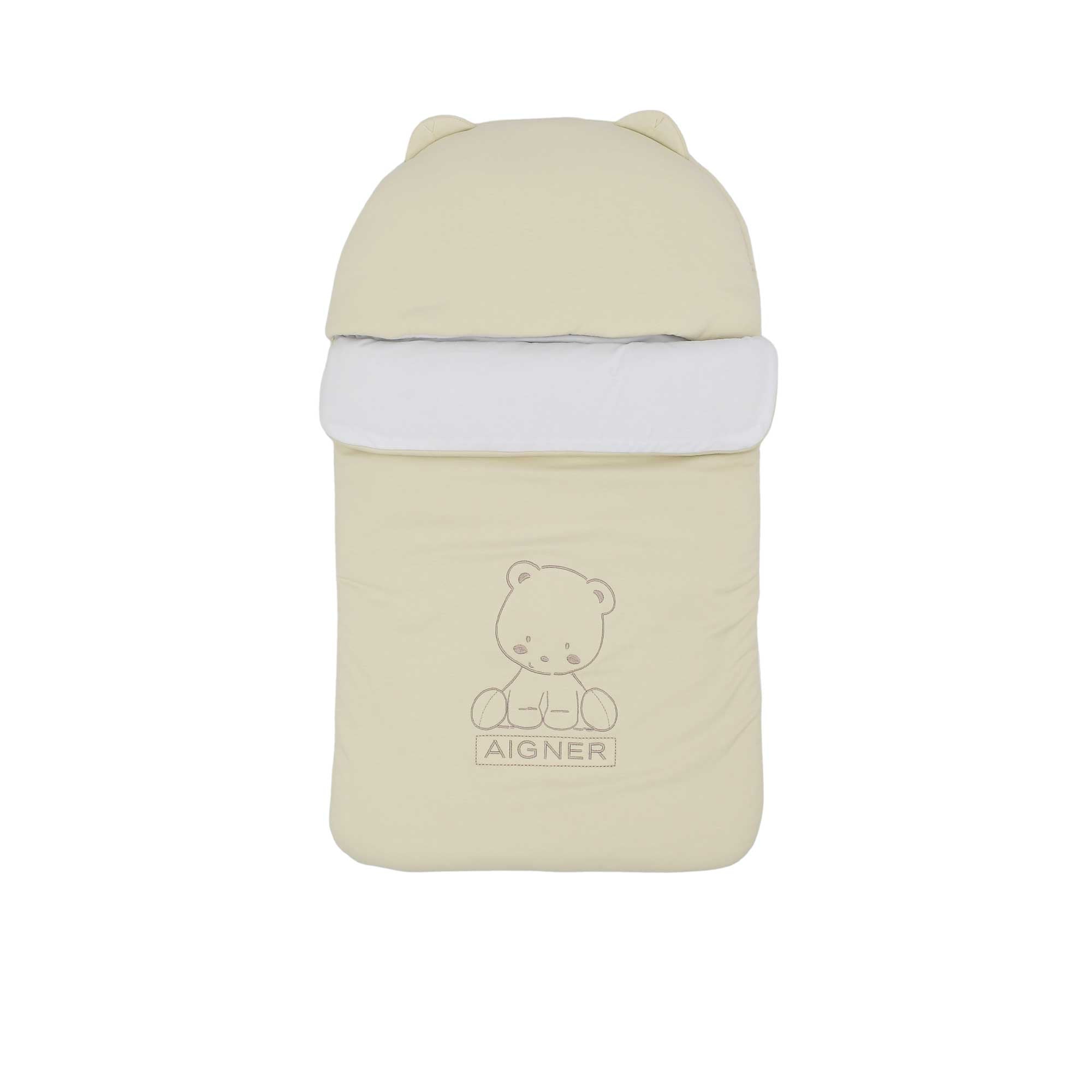 Front view of a cream Aigner Kids baby nest featuring an embroidered teddy bear, Aigner logo, and a hood with small rounded ears.