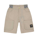Front view of Aigner Kids boys beige cargo shorts featuring a branded elasticated waistband, gold button closure, and large patch pockets with a square logo patch.