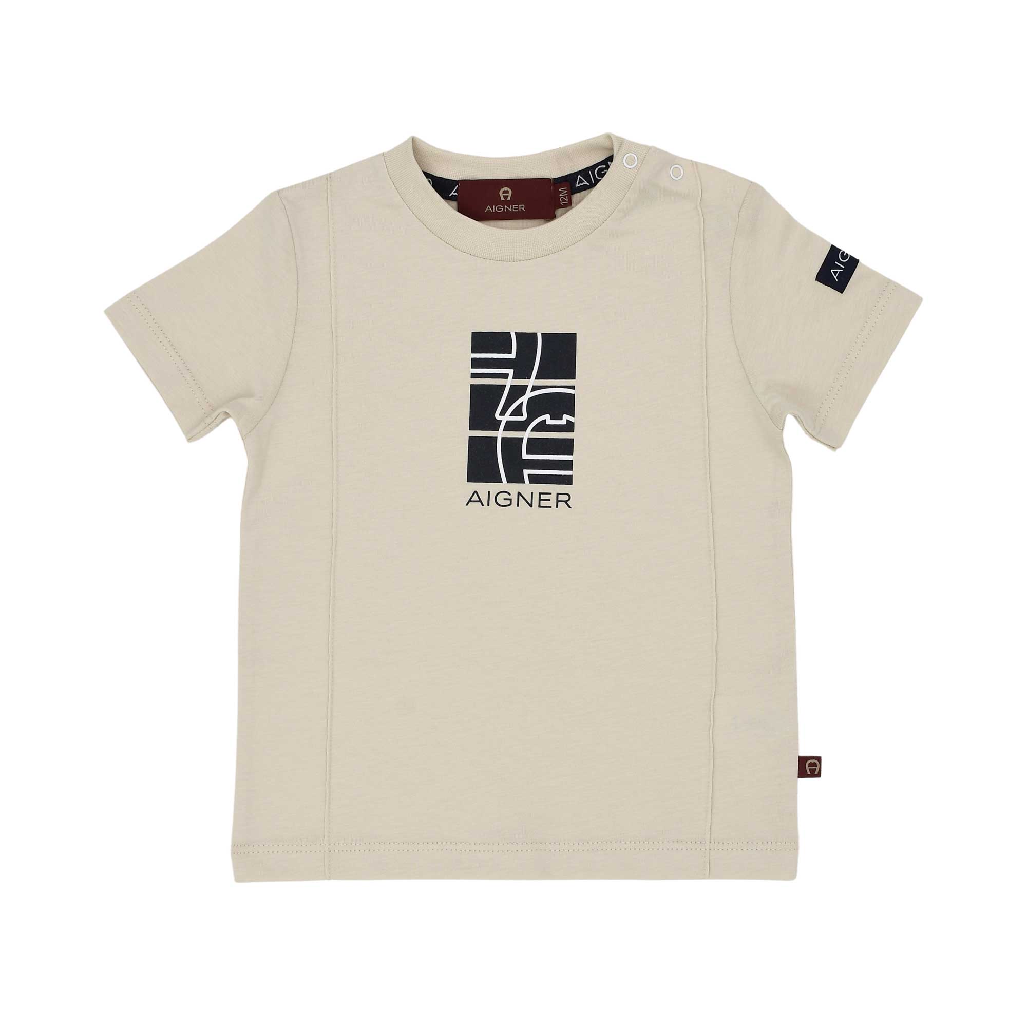 Front of an Aigner Kids beige short-sleeved T-shirt for boys featuring a black rectangular geometric logo print on the chest and popper buttons on the shoulder.
