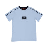 A light blue short-sleeved T-shirt for boys by Aigner Kids featuring a navy blue rectangular logo patch in the center and navy piping details running along the shoulders.