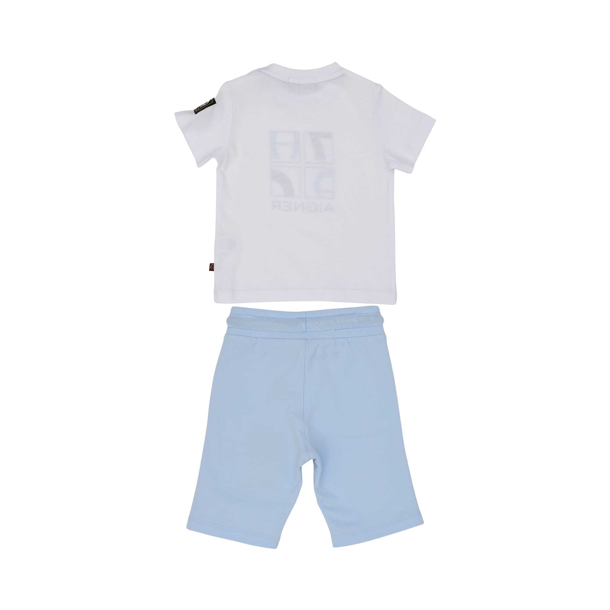Rear view of the Aigner Kids boy's set, displaying the clean white back of the shirt and the sporty fit of the light blue shorts.