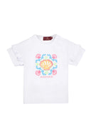 Front view flat-lay studio shot of the Aigner Kids girls white cotton T-shirt, highlighting its decorative double ruffle sleeves and the colorful pink, blue, and yellow seashell logo graphic.
