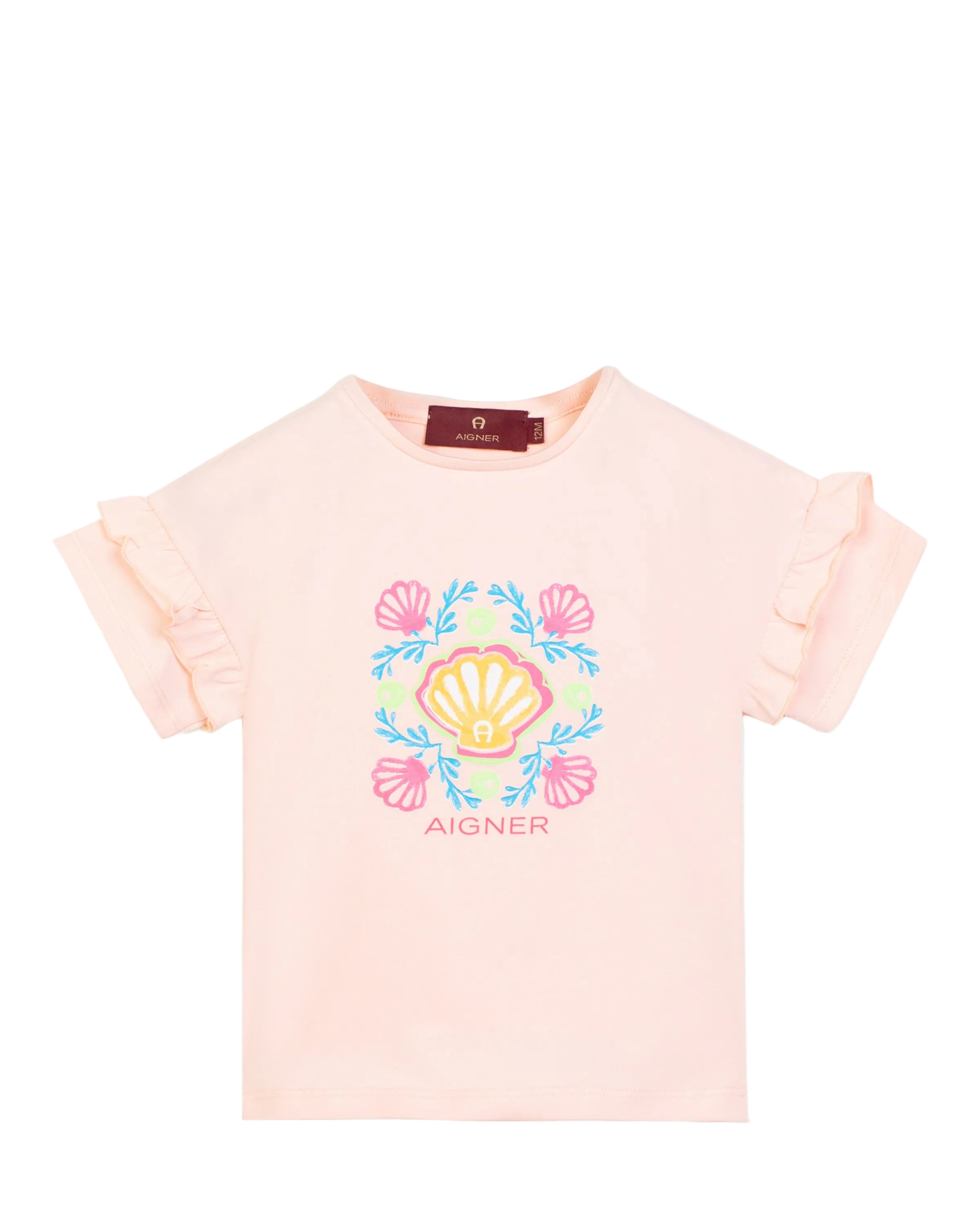 Front view flat-lay studio shot of the Aigner Kids girls pink cotton T-shirt, highlighting its decorative double ruffle sleeves and the colorful pink, blue, and yellow seashell logo graphic.