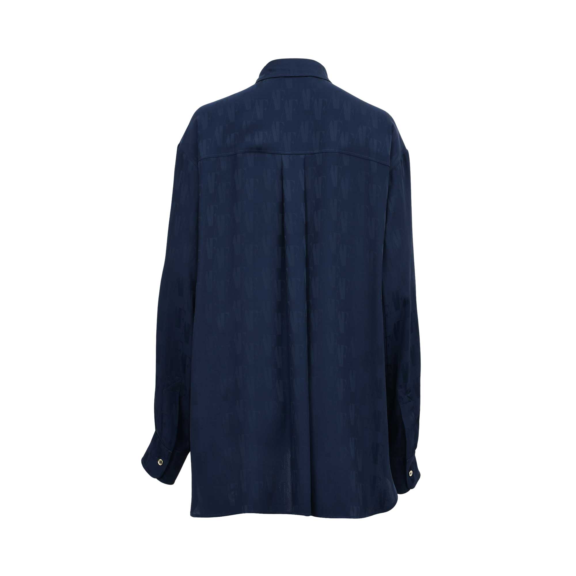 Back view of the navy blue monogram long-sleeve shirt, showcasing the relaxed fit and the subtle luster of the jacquard fabric.