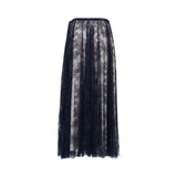 Back view of a full-length navy blue lace skirt, highlighting the seamless floral embroidery and the elegant flow of the sheer outer layer.