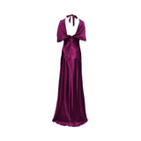 Back view of the fuchsia satin gown showing the deep open back, elegant self-tie halter bow, and a concealed zipper for a seamless finish.