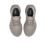 Top-down overhead view of the sneakers, displaying the dark charcoal grey insoles printed with the white Allbirds logo.