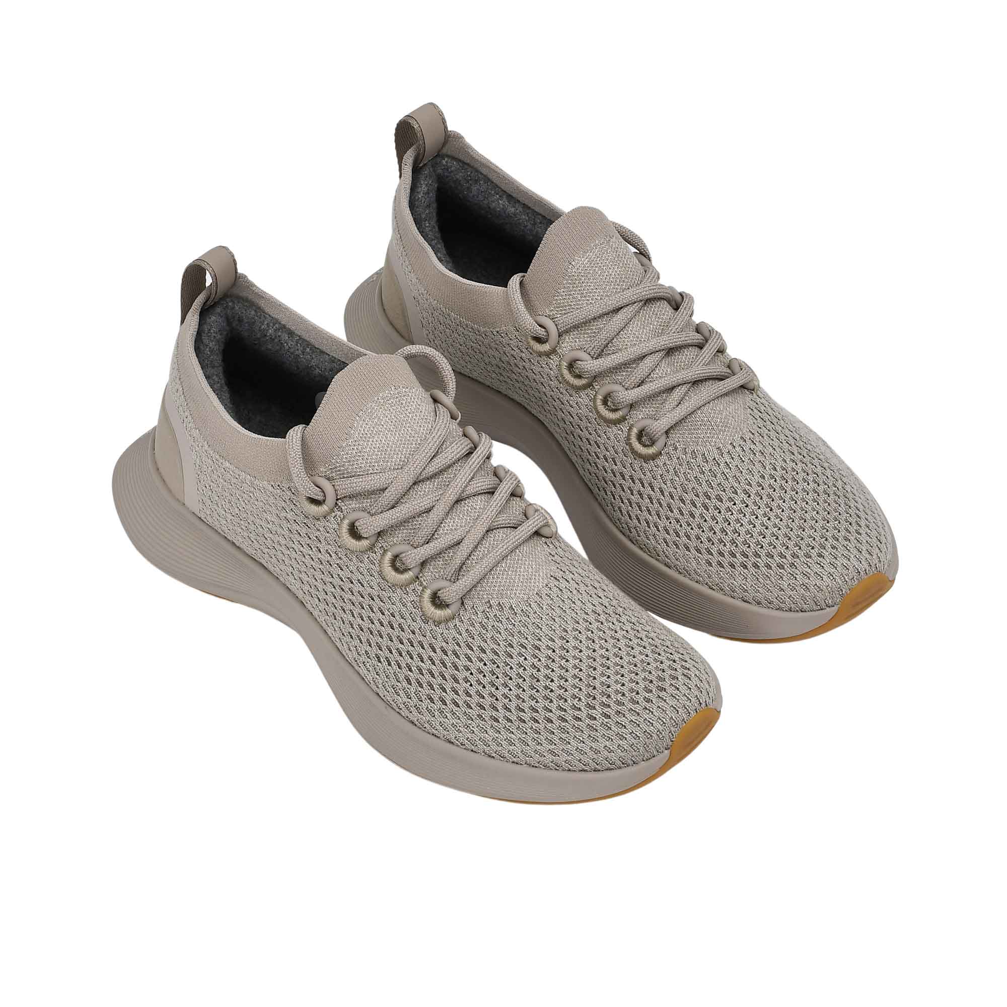 Full view of the natural rubber outsole, featuring a light grey traction tread pattern separated by a matching central foam groove.