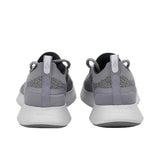 Rear view of the heels of the Allbirds Tree Dasher 2 sneakers, highlighting the flared white midsole and grey heel tabs with the embossed logo.