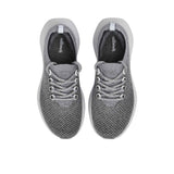 Top-down overhead view of the sneakers, displaying the dark charcoal grey insoles printed with the white Allbirds logo.