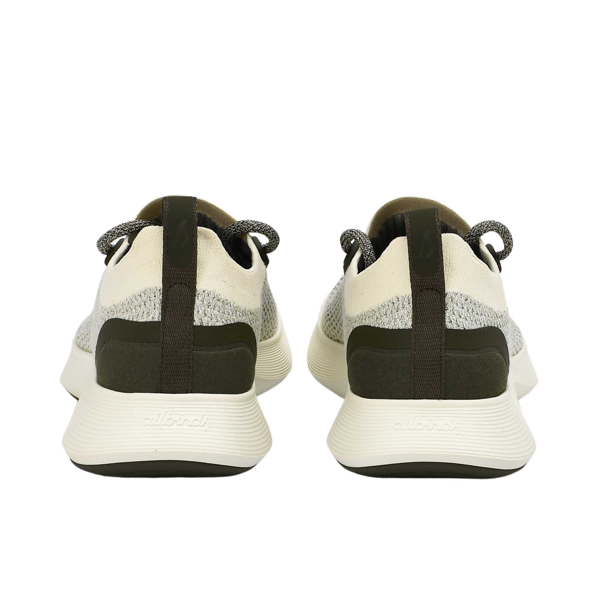 Rear view of the heels of the Allbirds Tree Dasher 2 sneakers, highlighting the flared dark midsole and black heel tabs with the embossed logo.