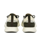 Rear view of the heels of the Allbirds Tree Dasher 2 sneakers, highlighting the flared dark midsole and black heel tabs with the embossed logo.