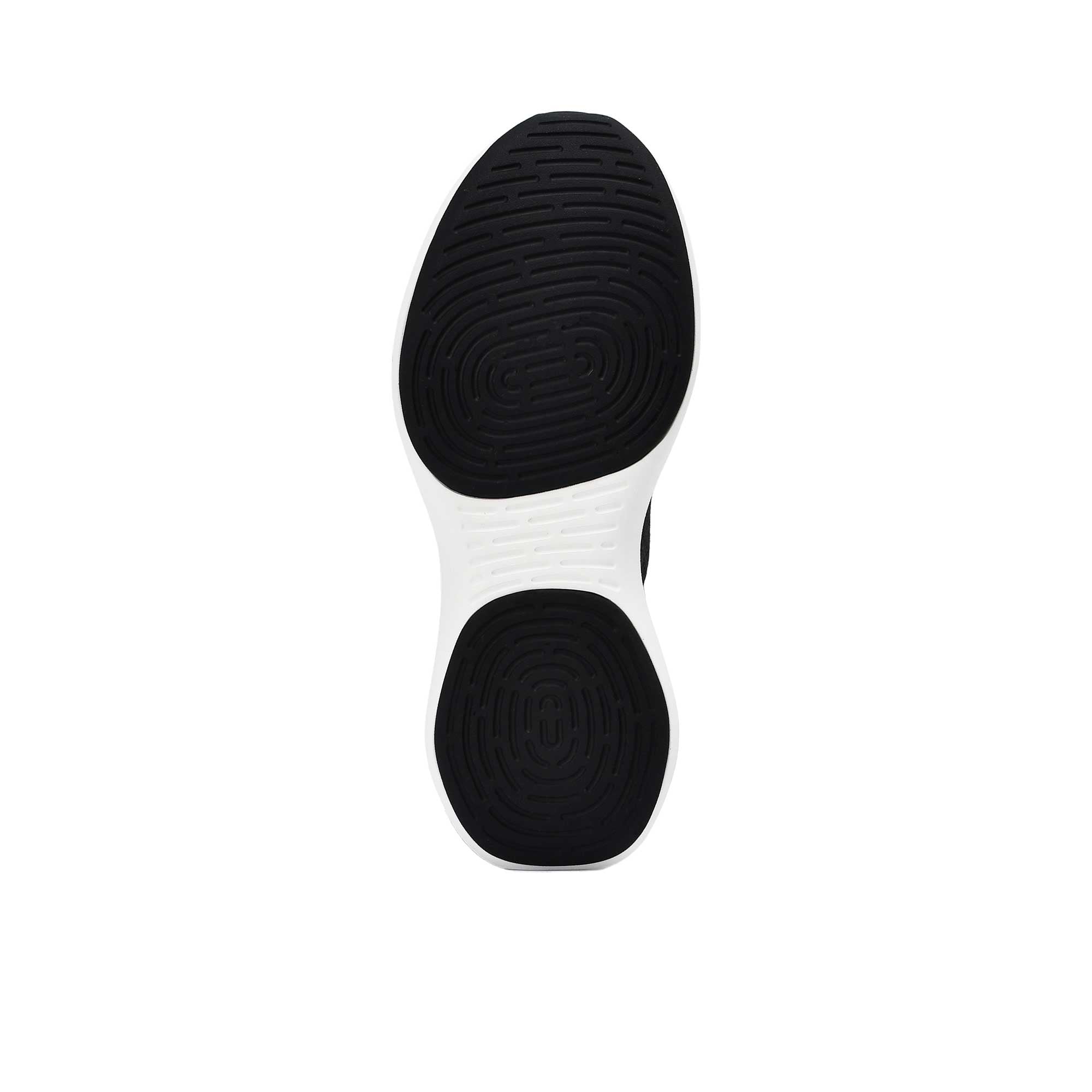 Close-up of a white sneaker sole with black tread pattern on a white background.