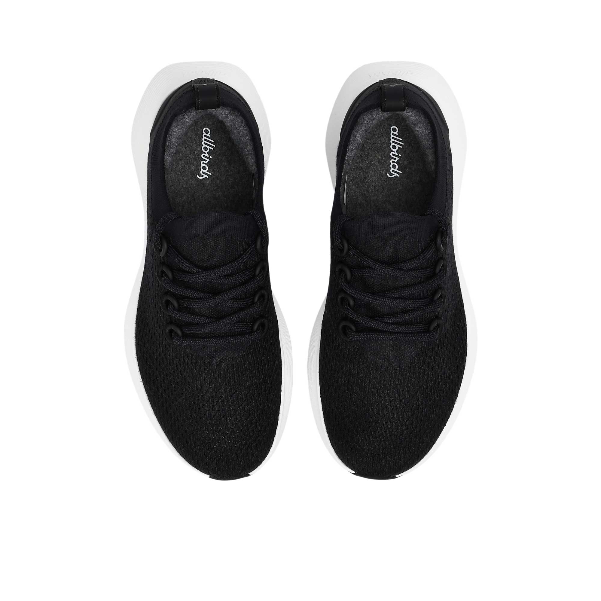Top-down overhead view of a pair of black Allbirds Tree Runner sneakers, showing the printed cursive "allbirds" logo on the gray insoles and the neat lacing layout.