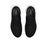 Top-down overhead view of a pair of black Allbirds Tree Runner sneakers, showing the printed cursive "allbirds" logo on the gray insoles and the neat lacing layout.