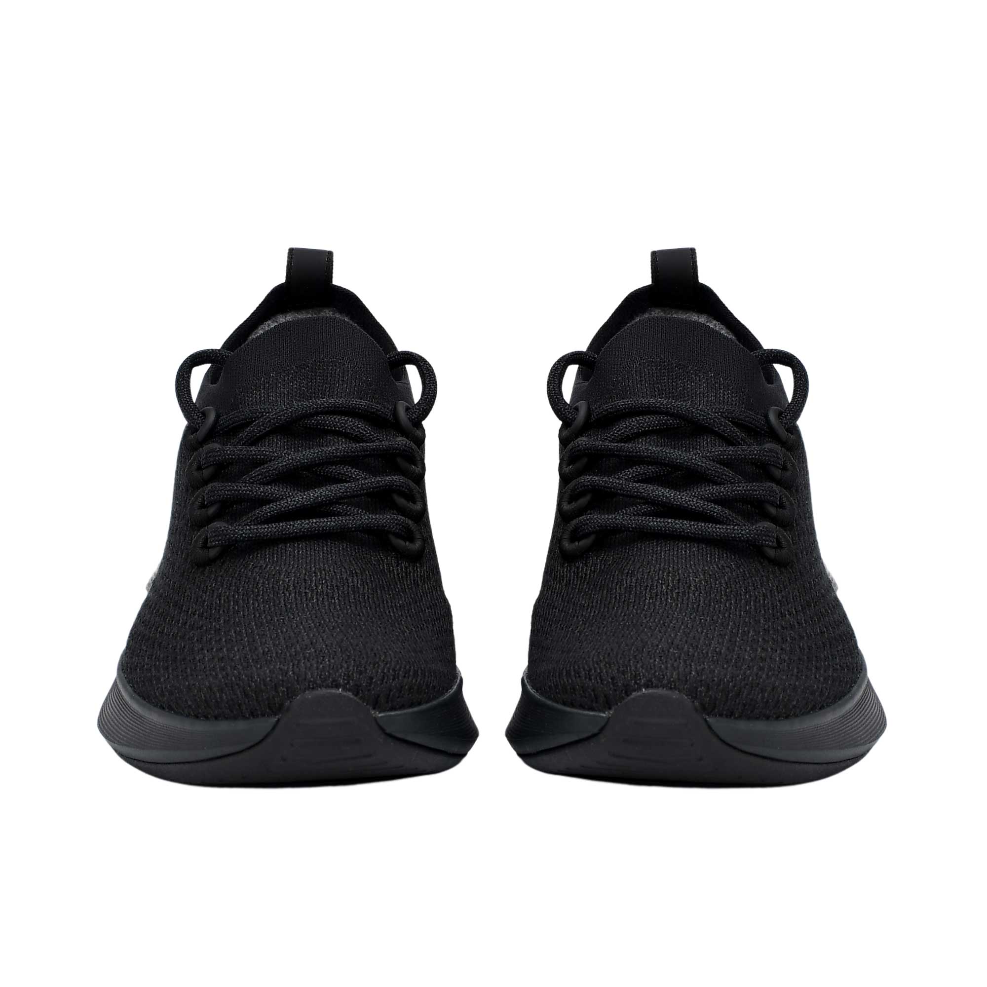 Front-facing view of a pair of triple-black Allbirds Tree Runner sneakers, showcasing their rounded toe boxes and symmetric textured lacing layout.