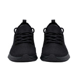Front-facing view of a pair of triple-black Allbirds Tree Runner sneakers, showcasing their rounded toe boxes and symmetric textured lacing layout.