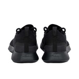 Rear view of a pair of black Allbirds Tree Runner sneakers, featuring fabric heel pull tabs and a subtle embossed "allbirds" logo on the textured black midsoles.