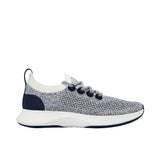 Profile view of a single Allbirds Tree Dasher 2 sneaker, showcasing its marled navy and white knit upper, dark navy blue eyelets, and chunky white midsole.