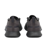 Rear view of the heels of the Allbirds Tree Dasher 2 sneakers, showcasing the flared midsole geometry and the embossed "allbirds" logo on the lower heel.