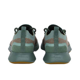 Rear view of the heels of the Allbirds Tree Dasher 2 sneakers, highlighting the flared white midsole and the grey pull tabs with the embossed logo.