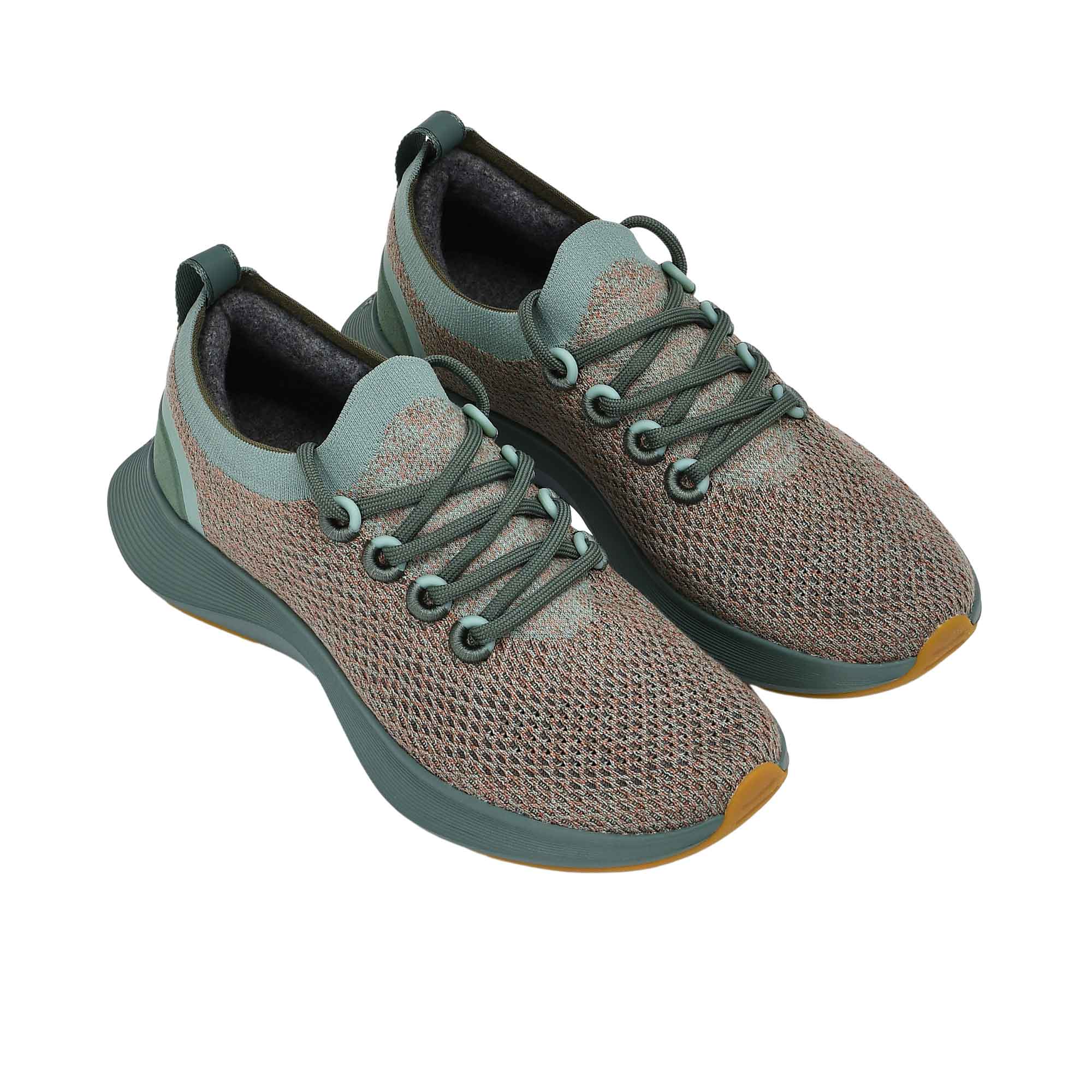 Full view of the natural rubber outsole, featuring a light pink forefoot tread and a dark grey heel tread separated by a white central foam channel.