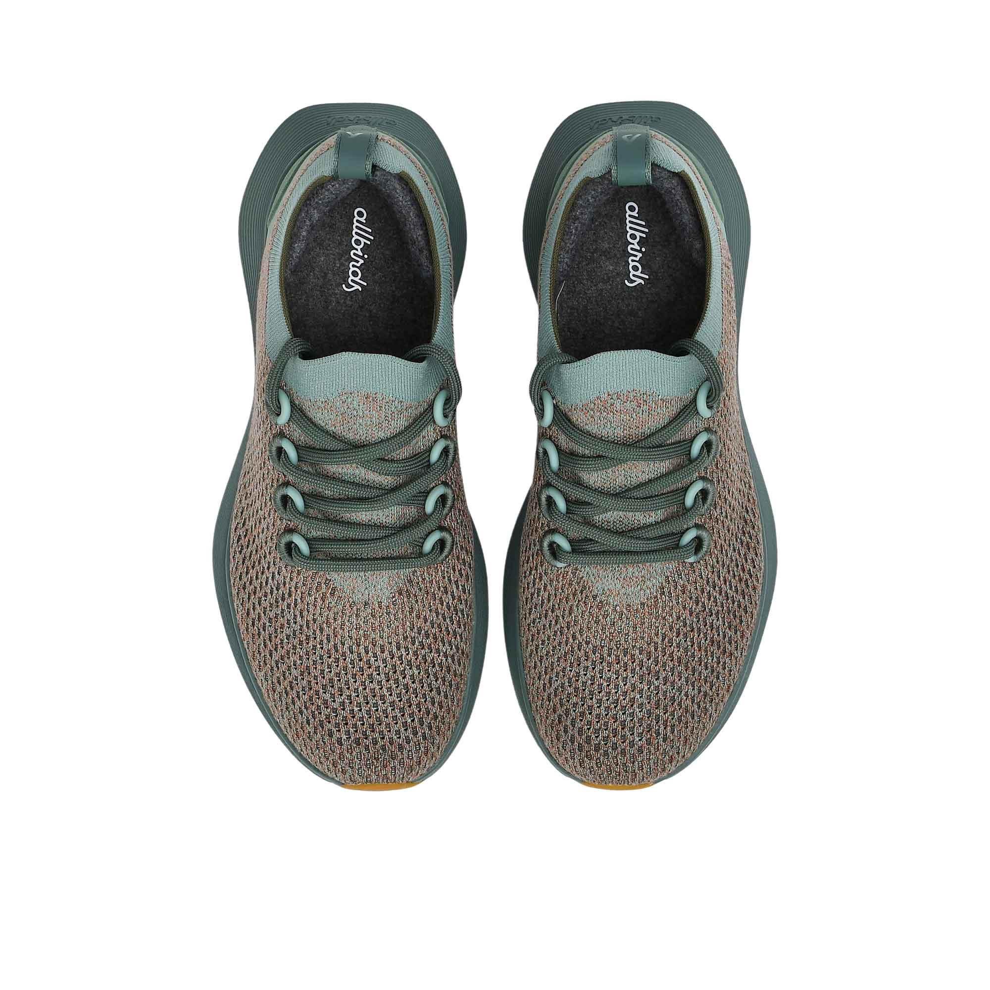 Top-down overhead view of the grey sneakers, displaying the dark grey insoles printed with the white Allbirds logo.