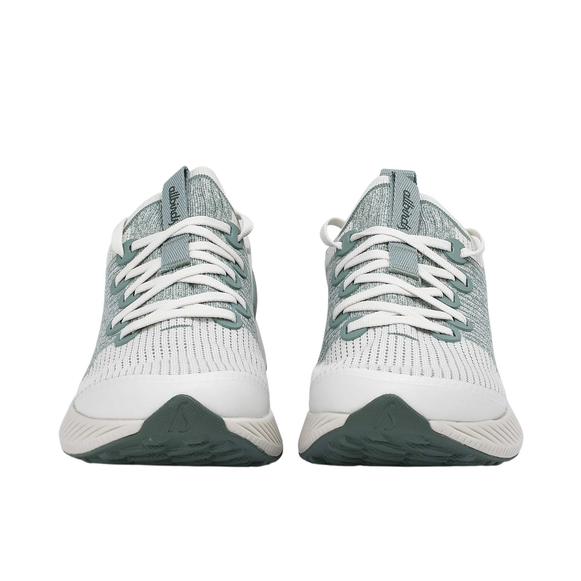 Front-facing view of a pair of Allbirds Tree Flyer running shoes highlighting the symmetrical toe guards, white laces, and sage green tongue tabs.