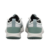 Elevated three-quarter perspective of a pair of Allbirds Tree Flyer sneakers showcasing the textured knit pattern, white laces, and sage green detailing.