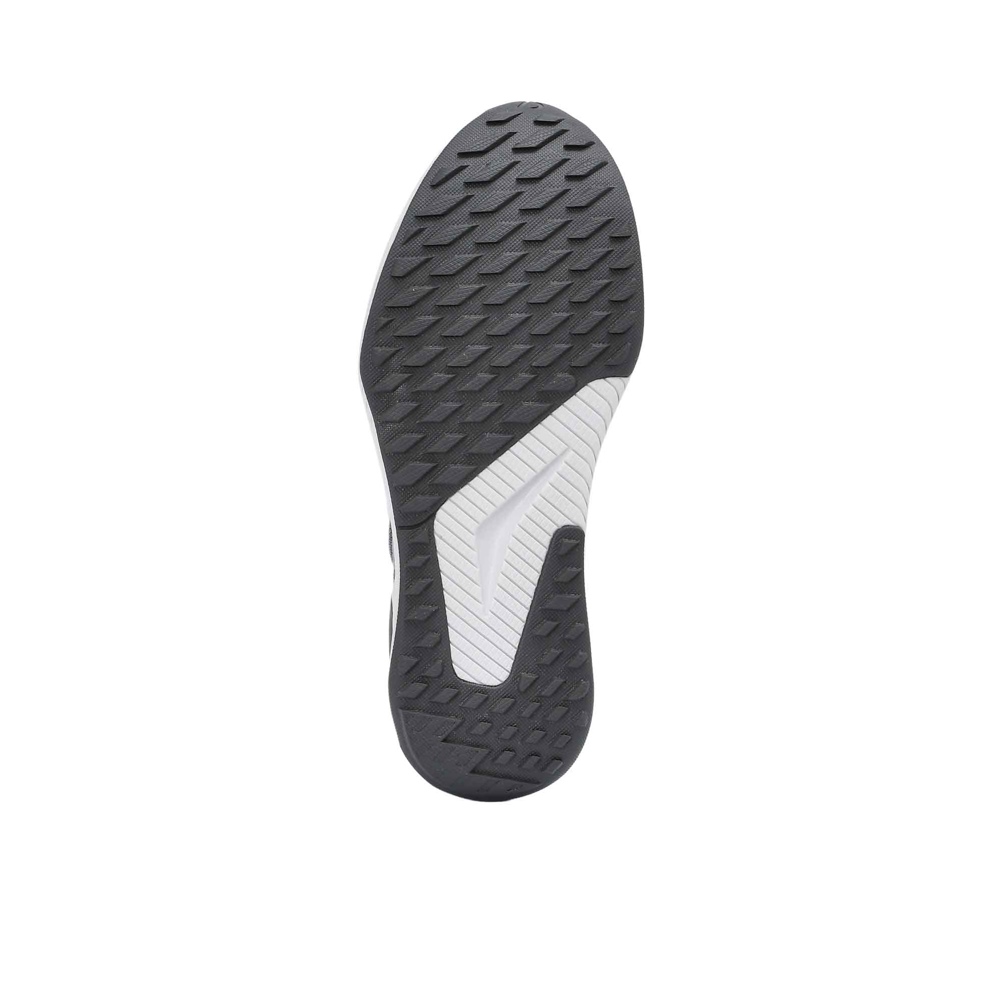 Close-up of a shoe sole with black and white design on a white background.
