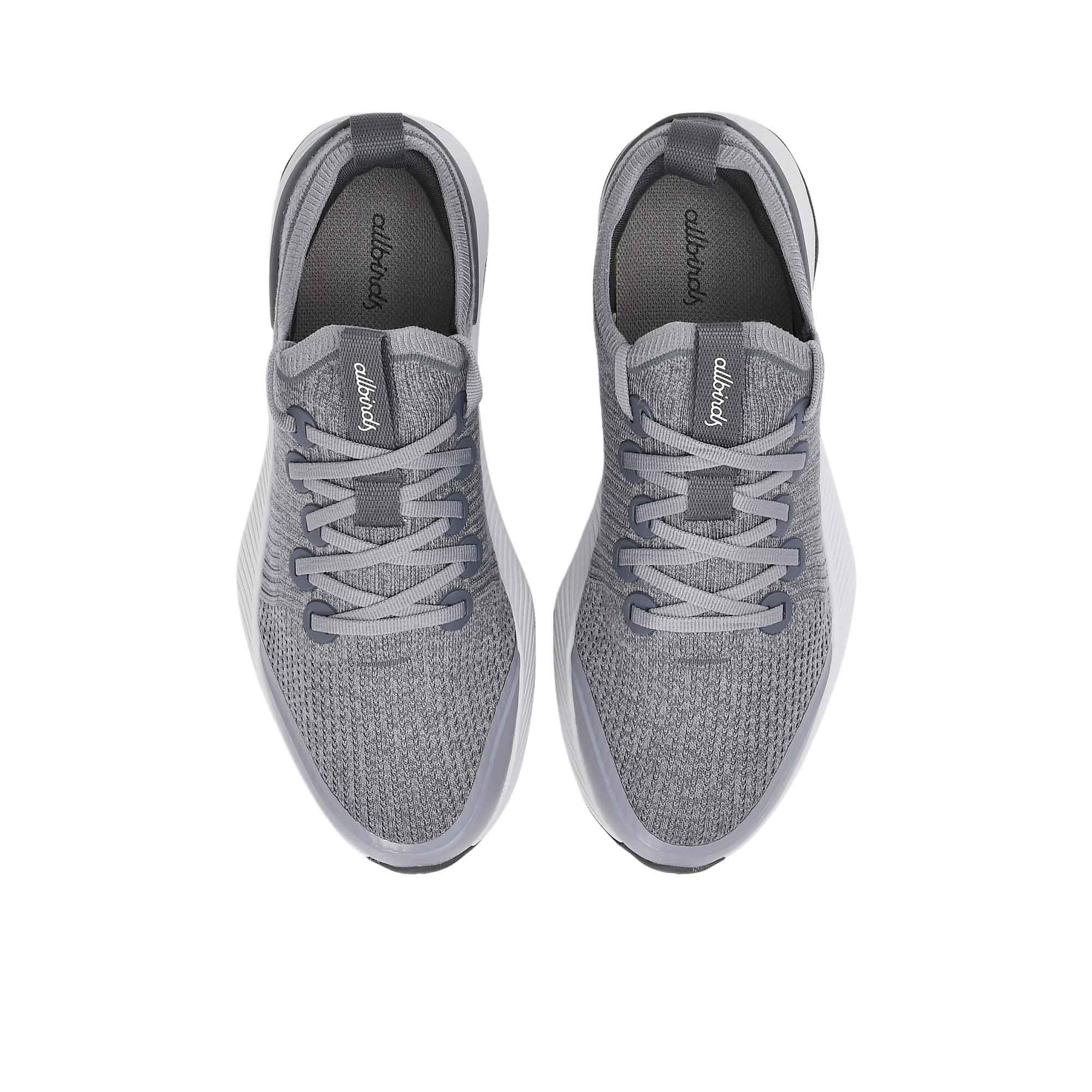Pair of gray athletic shoes on a white background.
