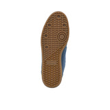 Close-up of a shoe sole with tread pattern on a white background.