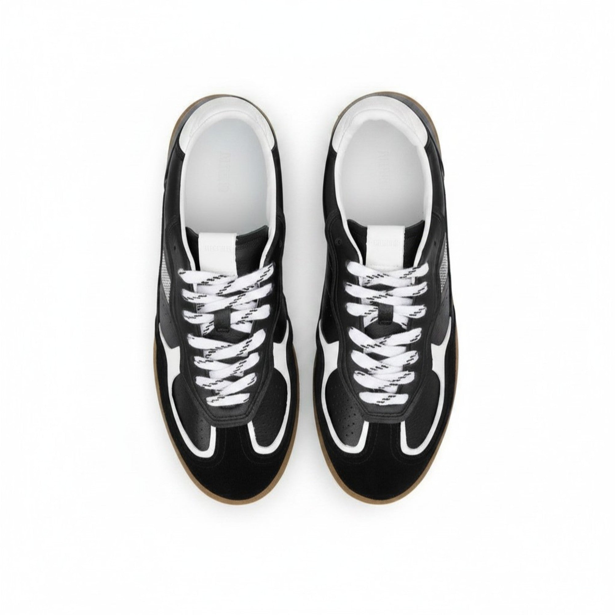Black sneakers with white laces on a white background.