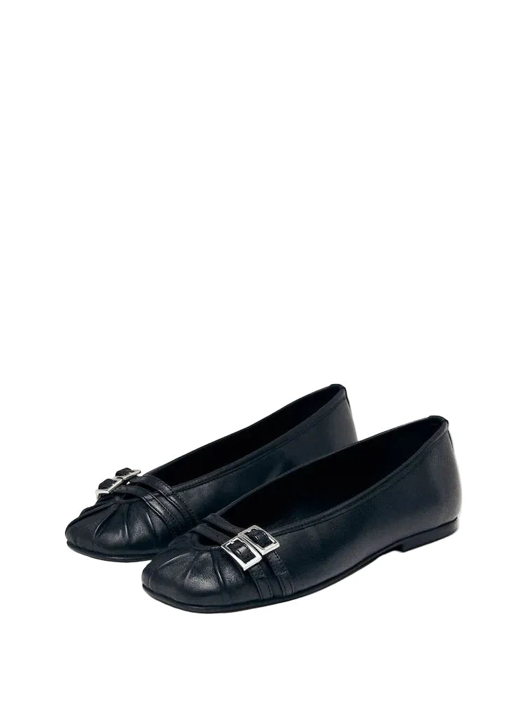 A pair of ALOHAS black leather buckled ballet flats shown from a 3/4 angle, highlighting the ruched toe box and polished silver hardware.