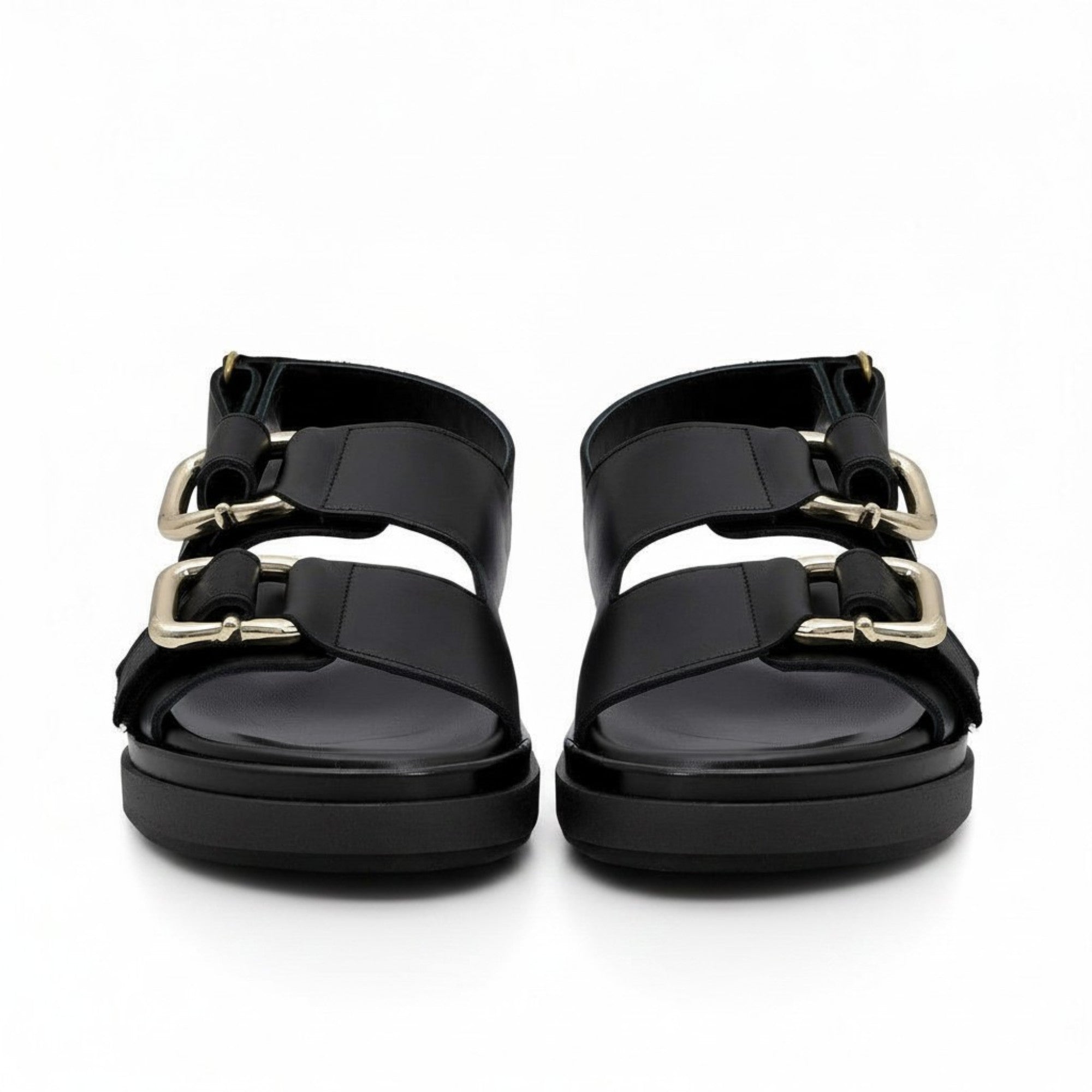 Front face-on view of a pair of ALOHAS silver pointed-toe flats showcasing the modern square-cut throat line over the vamp.