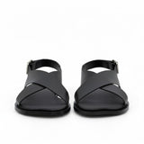 Front view of a pair of ALOHAS beige sandals showing the wide crossover asymmetric straps with fine dark piping.