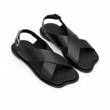 Oblique overhead view of a pair of ALOHAS beige crossover sandals showcasing the unique contoured shape of the toe box and subtle footbed branding.