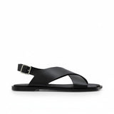 Side profile view of a single ALOHAS beige crossover slingback sandal with a silver-tone buckle and flat black sole against a white background.