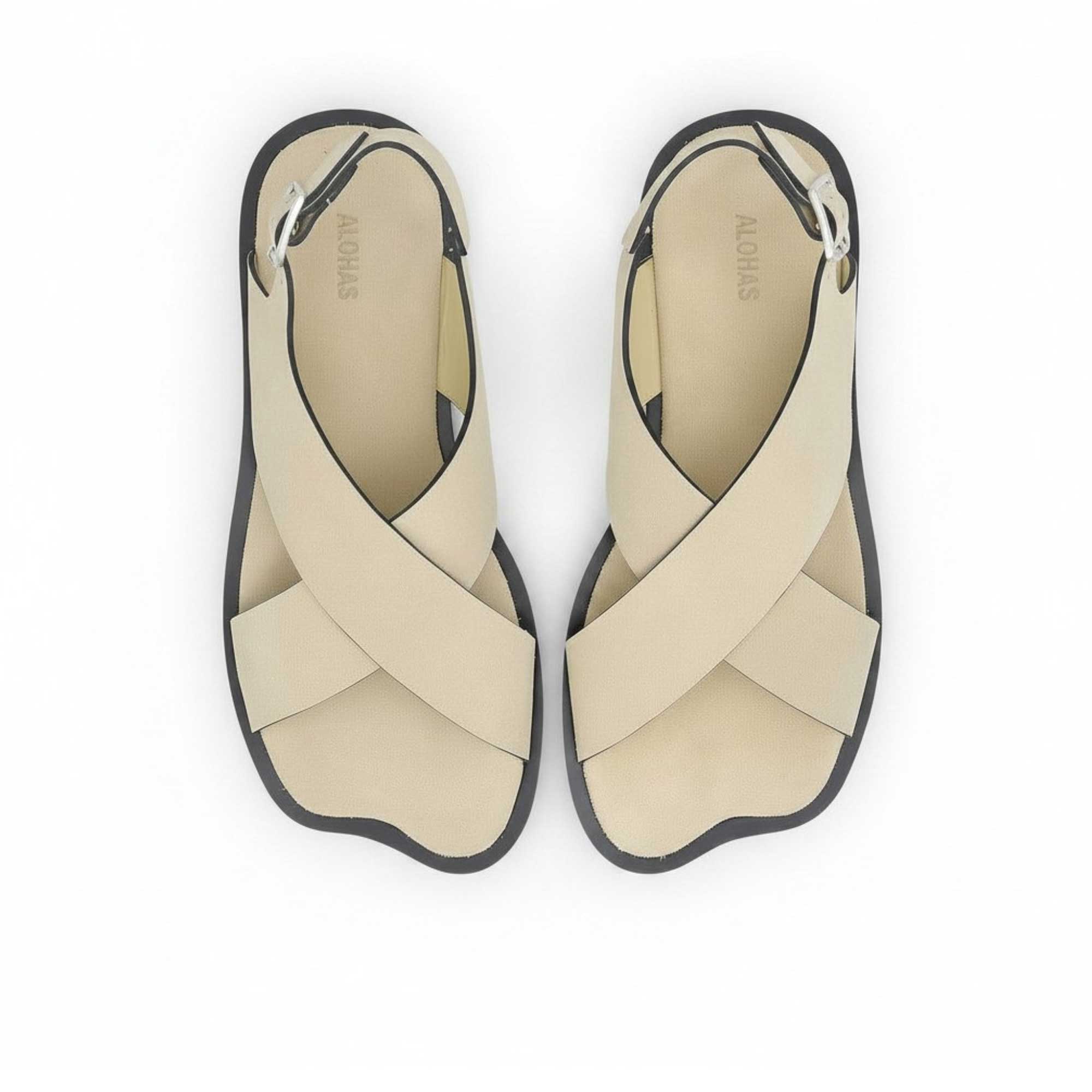 Top-down bird's-eye view of a pair of ALOHAS beige asymmetric strap sandals with printed logos on the insoles.