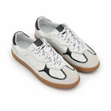 Oblique overhead view of a pair of ALOHAS white leather and burgundy suede sneakers displaying their retro silhouette and clean white lining.